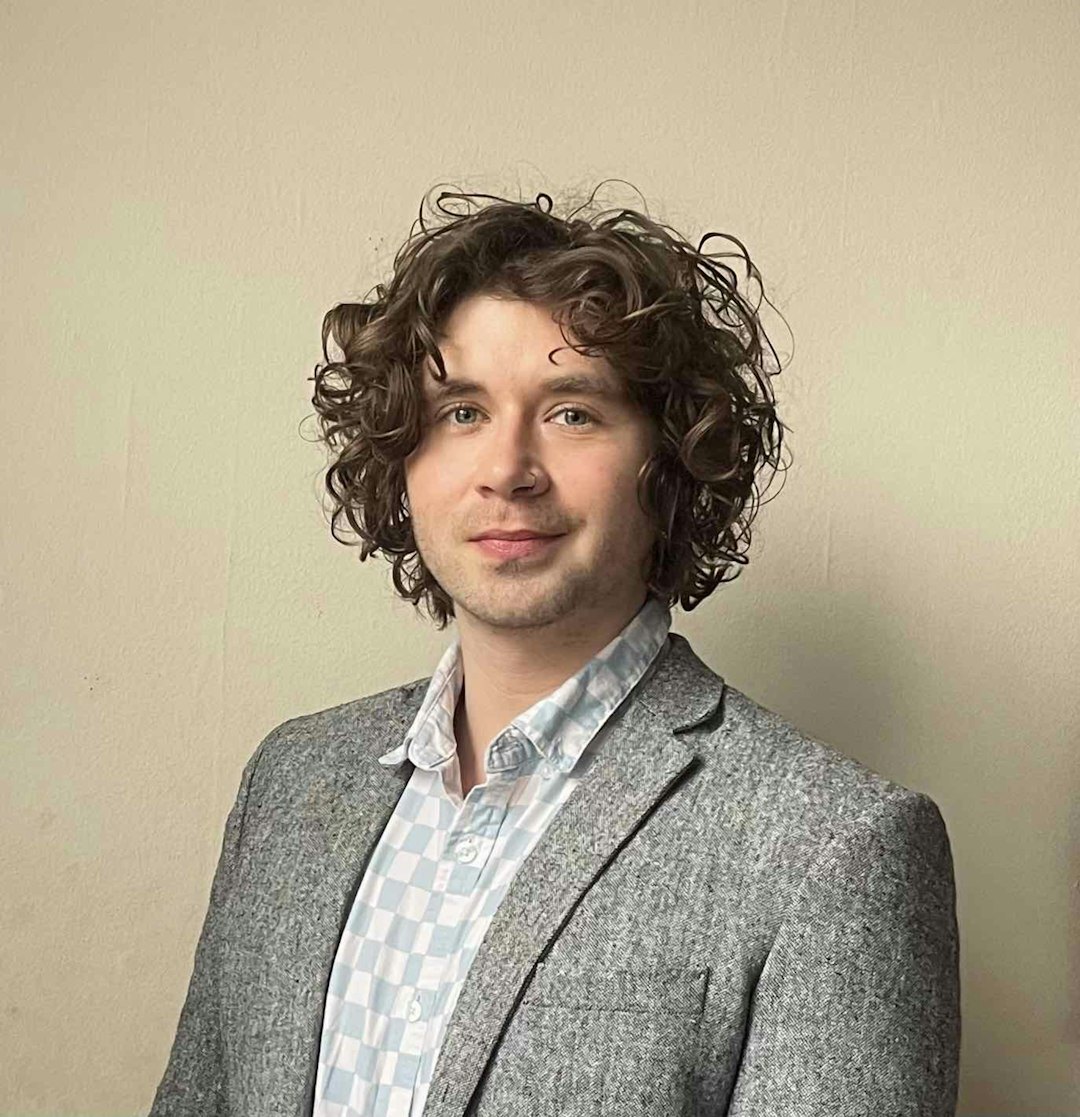 Young professional man with dark hair in studio portrait