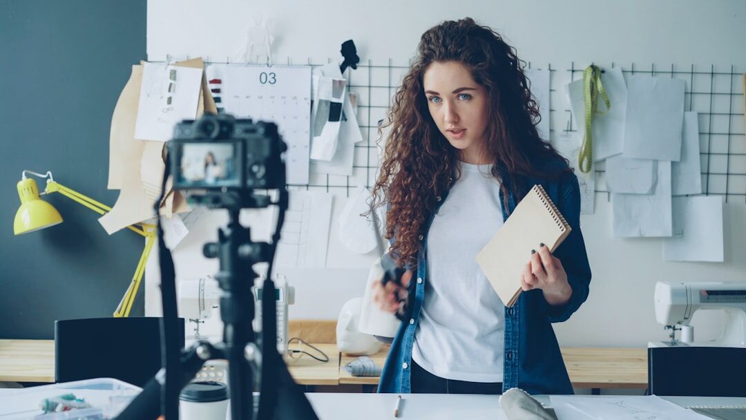 Female presenter practicing delivery in front of teleprompter