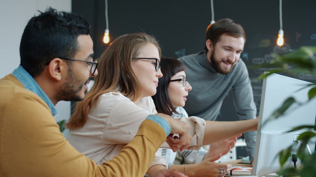 Team of professionals working together around a table in a modern office